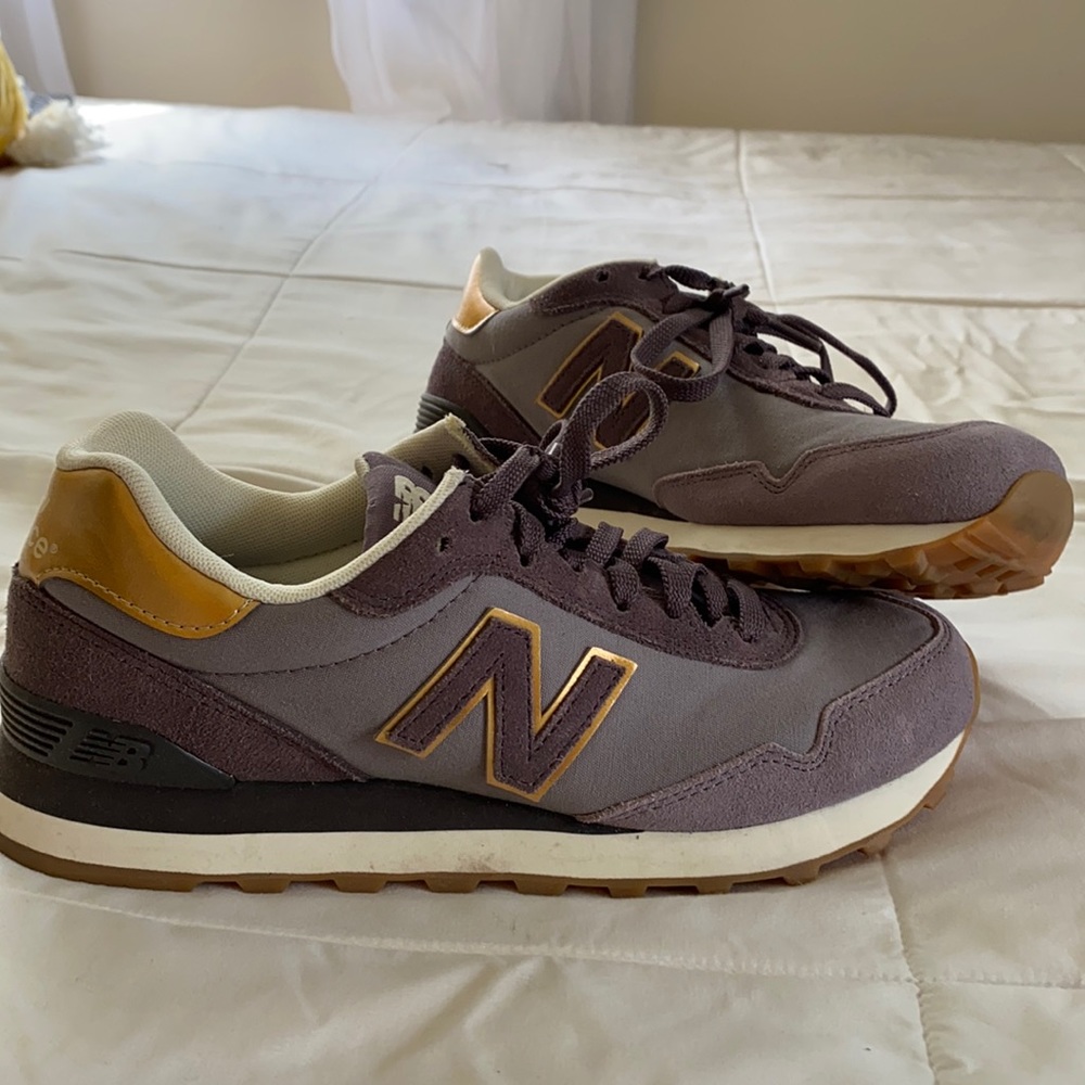 Purple and gold New Balance shoes